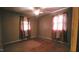 Bedroom boasting hardwood floors and natural light from windows with curtains at 2100 N Webb St, Selma, NC 27576