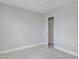 Bright bedroom with neutral carpet and an open closet featuring a shelf and clothing bar at 226 Faith Avenue, Sanford, NC 27330