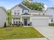 Charming two-story home with a well-manicured lawn and inviting curb appeal at 226 Faith Avenue, Sanford, NC 27330