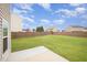 Spacious backyard with lush green grass and a tall wooden privacy fence at 2309 King Malcolm Ln, Zebulon, NC 27597