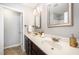Bathroom featuring double sinks, framed mirrors, and modern lighting fixtures at 2309 King Malcolm Ln, Zebulon, NC 27597