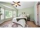 Cozy bedroom featuring vaulted ceiling, large windows, and natural light at 2309 King Malcolm Ln, Zebulon, NC 27597