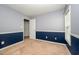 Bedroom features two-tone walls, carpet flooring, and double doors at 2309 King Malcolm Ln, Zebulon, NC 27597