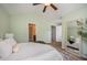 Inviting bedroom featuring two doorways, a mirror, and views to an en-suite bathroom at 2309 King Malcolm Ln, Zebulon, NC 27597