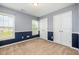 Bedroom featuring a two-tone paint scheme, and large windows at 2309 King Malcolm Ln, Zebulon, NC 27597