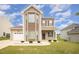 Charming two-story home with attached garage, well-maintained lawn, and appealing curb appeal at 2309 King Malcolm Ln, Zebulon, NC 27597