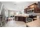 Well-equipped kitchen featuring stainless steel appliances, dark cabinets, and open access to dining area at 2309 King Malcolm Ln, Zebulon, NC 27597