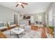 Open living space with hardwood floors, ceiling fan, connected kitchen, and eating nook at 2309 King Malcolm Ln, Zebulon, NC 27597
