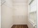 Walk-in closet features shelving and a bright window at 2309 King Malcolm Ln, Zebulon, NC 27597