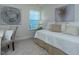 Cozy bedroom with a comfortable bed, chair, and artwork, bathed in natural light at 233 Steel Spring Rd # 24, Angier, NC 27501