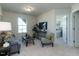 Inviting living room featuring cozy seating, a large window and soft carpeting at 233 Steel Spring Rd # 24, Angier, NC 27501