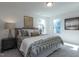 Comfortable main bedroom with plush bedding, natural light, and neutral decor at 233 Steel Spring Rd # 24, Angier, NC 27501