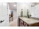 Bathroom with a granite countertop, a framed mirror, and updated fixtures at 238 Lynchwick Ln, Durham, NC 27703