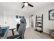 A carpeted bedroom featuring a shelf, sports decor, and a doorway to another room at 238 Lynchwick Ln, Durham, NC 27703