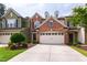 Charming exterior view of townhome with attached garage and well-maintained landscaping at 238 Lynchwick Ln, Durham, NC 27703