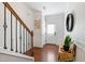 Bright foyer with hardwood floors, decorative accents, and staircase at 238 Lynchwick Ln, Durham, NC 27703
