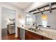 Modern kitchen featuring stainless steel appliances, granite countertops, and ample wood cabinetry at 238 Lynchwick Ln, Durham, NC 27703
