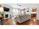 Inviting living room featuring a fireplace, TV, and open access to the kitchen at 238 Lynchwick Ln, Durham, NC 27703