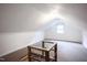 Finished attic space features carpet and bright natural light from a window at 2423 Farthing St, Durham, NC 27704