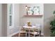 Charming dining area featuring a round table, stylish chairs, and a sunlit window at 2423 Farthing St, Durham, NC 27704