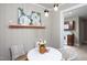 Sun-drenched dining area with a charming table set, complemented by elegant decor at 2423 Farthing St, Durham, NC 27704