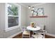 Bright dining area offering a round table, comfortable seating, and a view of the outdoors at 2423 Farthing St, Durham, NC 27704