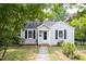 Charming one story home with black shutters and a sidewalk leading up to the front door at 2423 Farthing St, Durham, NC 27704