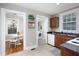 Kitchen with a view into the dining area and laundry, maximizing space and functionality at 2423 Farthing St, Durham, NC 27704