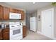 Efficient kitchen layout with essential appliances and natural light, perfect for everyday cooking at 2423 Farthing St, Durham, NC 27704