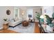 Bright and airy living room featuring hardwood floors and large windows at 2423 Farthing St, Durham, NC 27704