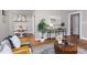 Open-concept living room with classic wood floors, ample natural light, and decorative accents at 2423 Farthing St, Durham, NC 27704