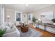 Comfortable living room with neutral colors and hardwood floors at 2423 Farthing St, Durham, NC 27704