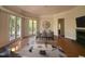 Elegant dining room featuring a fireplace, hardwood floors, and French doors at 2428 Perkins Rd, Durham, NC 27705