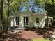 Charming exterior featuring manicured yard, and updated brick walkway at 2428 Perkins Rd, Durham, NC 27705