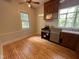 Bright kitchen features stainless steel appliances and hardwood floors at 2428 Perkins Rd, Durham, NC 27705
