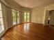 Inviting living room with hardwood floors and French doors allowing abundant natural light at 2428 Perkins Rd, Durham, NC 27705
