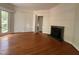 Spacious Living Room area featuring hardwood floors, fireplace and natural light at 2428 Perkins Rd, Durham, NC 27705