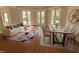 Open-concept living and dining area with hardwood floors and multiple doors to the yard at 2428 Perkins Rd, Durham, NC 27705