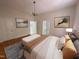 Inviting main bedroom with hardwood floors and soft lighting and neutral tones at 2428 Perkins Rd, Durham, NC 27705
