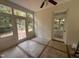 Sun Room offering brick floors and featuring many windows and a ceiling fan at 2428 Perkins Rd, Durham, NC 27705
