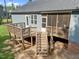 Outdoor view featuring a back deck, screened porch, stairs and a view of the backyard at 244 Lasswade Ct, Zebulon, NC 27597