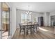 Cozy dining area with natural light, wooden table, and easy access to the laundry room at 244 Lasswade Ct, Zebulon, NC 27597