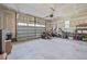 Spacious garage with an open garage door, a well-maintained lawn mower, and ample storage space at 244 Lasswade Ct, Zebulon, NC 27597