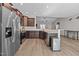 Stylish kitchen with stainless steel appliances, dark cabinets, and an open layout at 244 Lasswade Ct, Zebulon, NC 27597