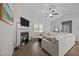 Comfortable living room with a fireplace, hardwood floors, and neutral-toned furniture at 244 Lasswade Ct, Zebulon, NC 27597