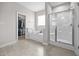 Elegant main bathroom with a soaking tub, shower, and a walk-in closet at 244 Lasswade Ct, Zebulon, NC 27597
