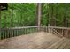 View of a wooden deck overlooking a backyard forest at 252 Fox Ridge, Pittsboro, NC 27312