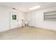 View of a basement, featuring an utility sink, door to outside, and small storage at 252 Fox Ridge, Pittsboro, NC 27312