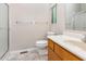Modest bathroom with tile floor, walk-in shower, toilet, and wood vanity at 252 Fox Ridge, Pittsboro, NC 27312