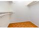 A simple walk-in closet design with mounted shelf and closet rod at 252 Fox Ridge, Pittsboro, NC 27312